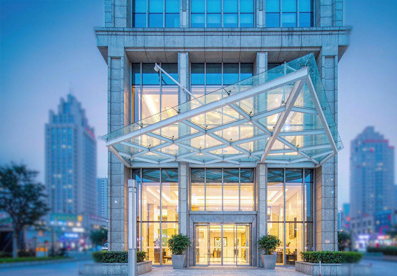 A modern Beijing international hotel lit at blue hour