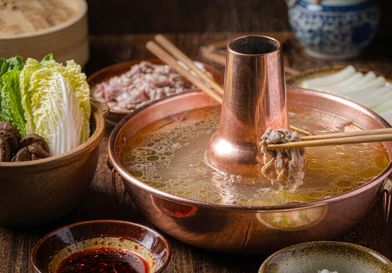 Traditional Beijing copper hotpot with sliced lamb