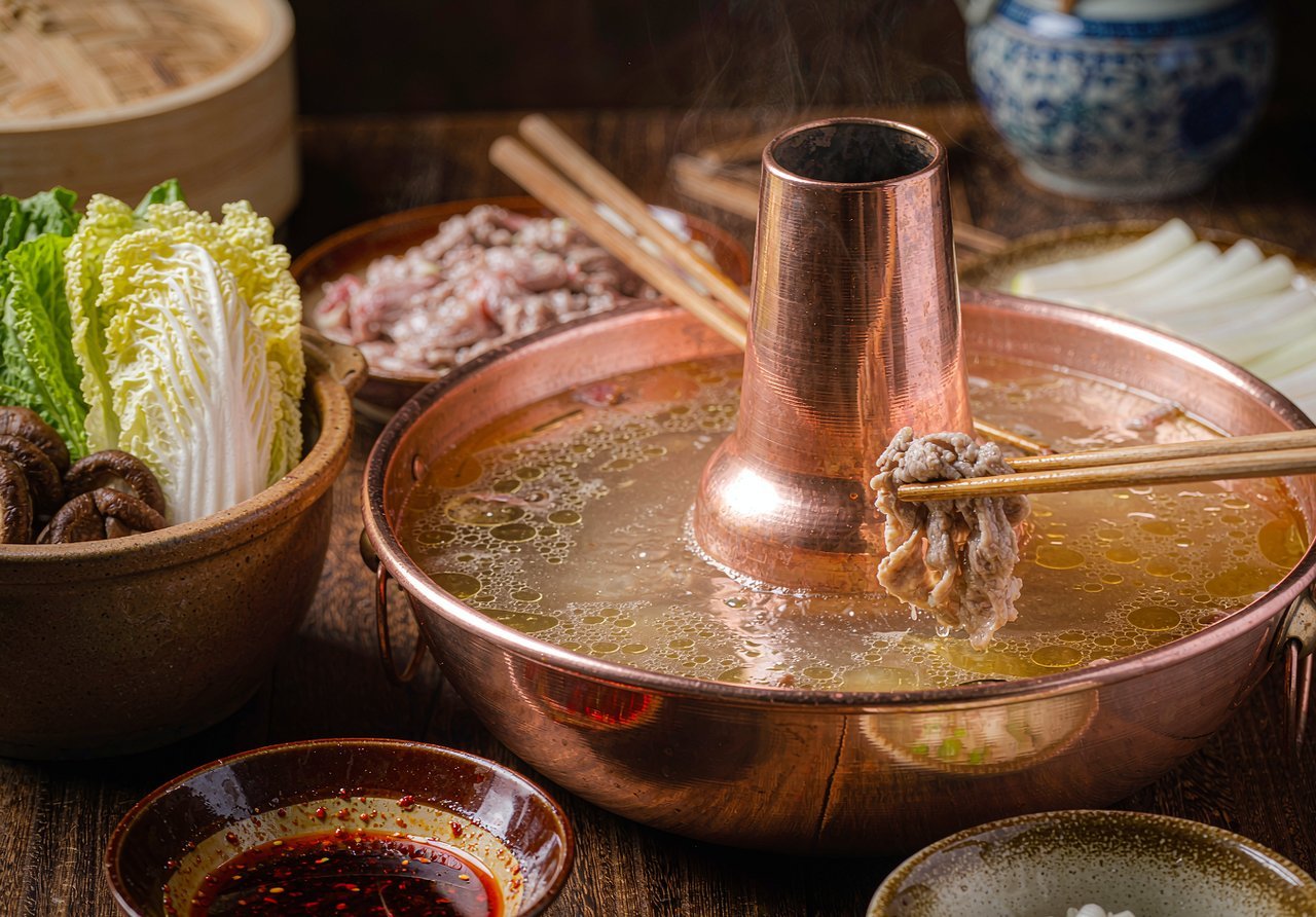 Chinese hotpot with sliced lamb and vegetables