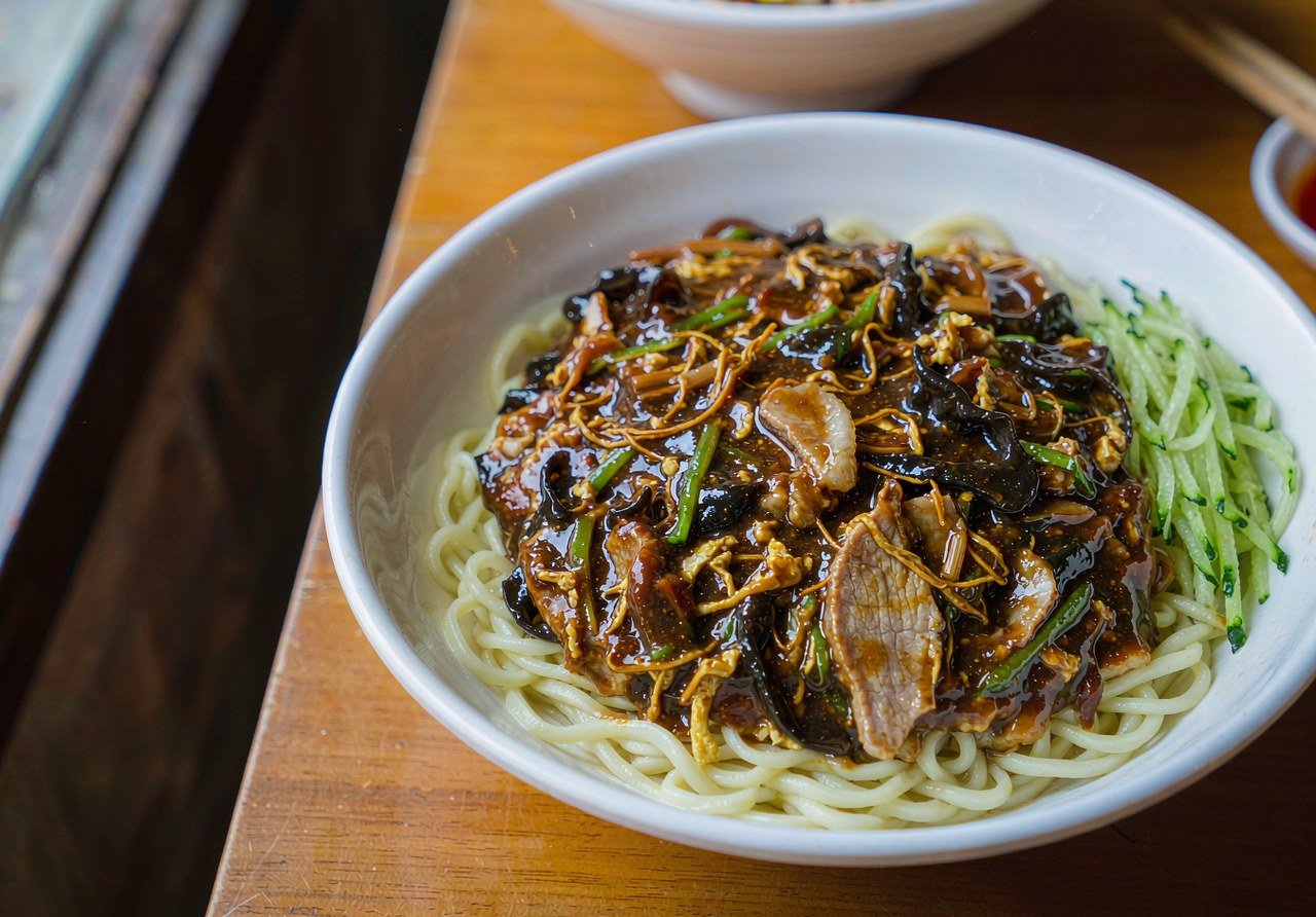 Authentic Beijing dalu mian noodles in savory gravy with pork, wood ear mushrooms and egg