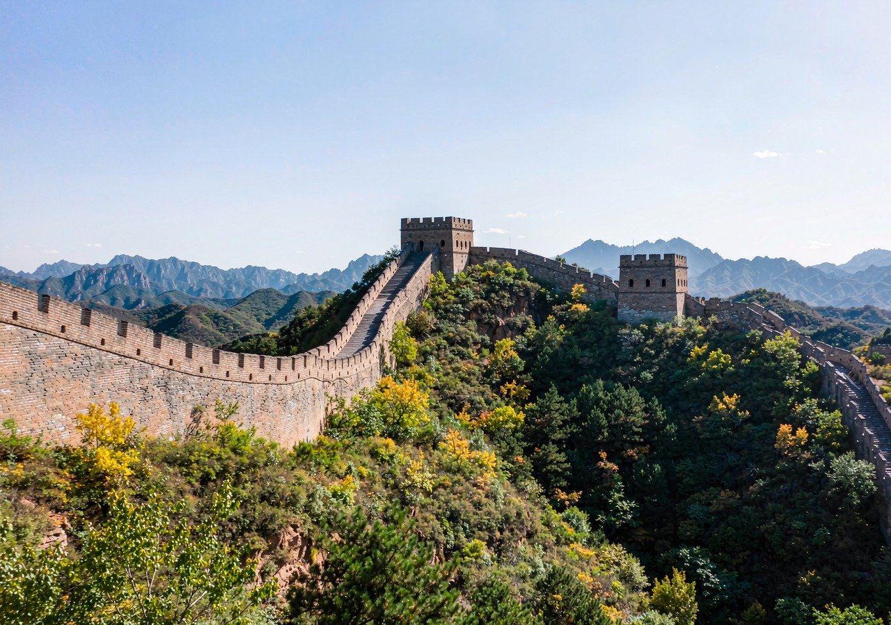 The Great Wall at Mutianyu winding over forested mountains