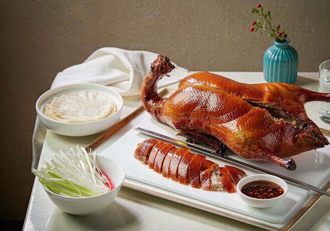 A whole Peking duck served with pancakes and scallions