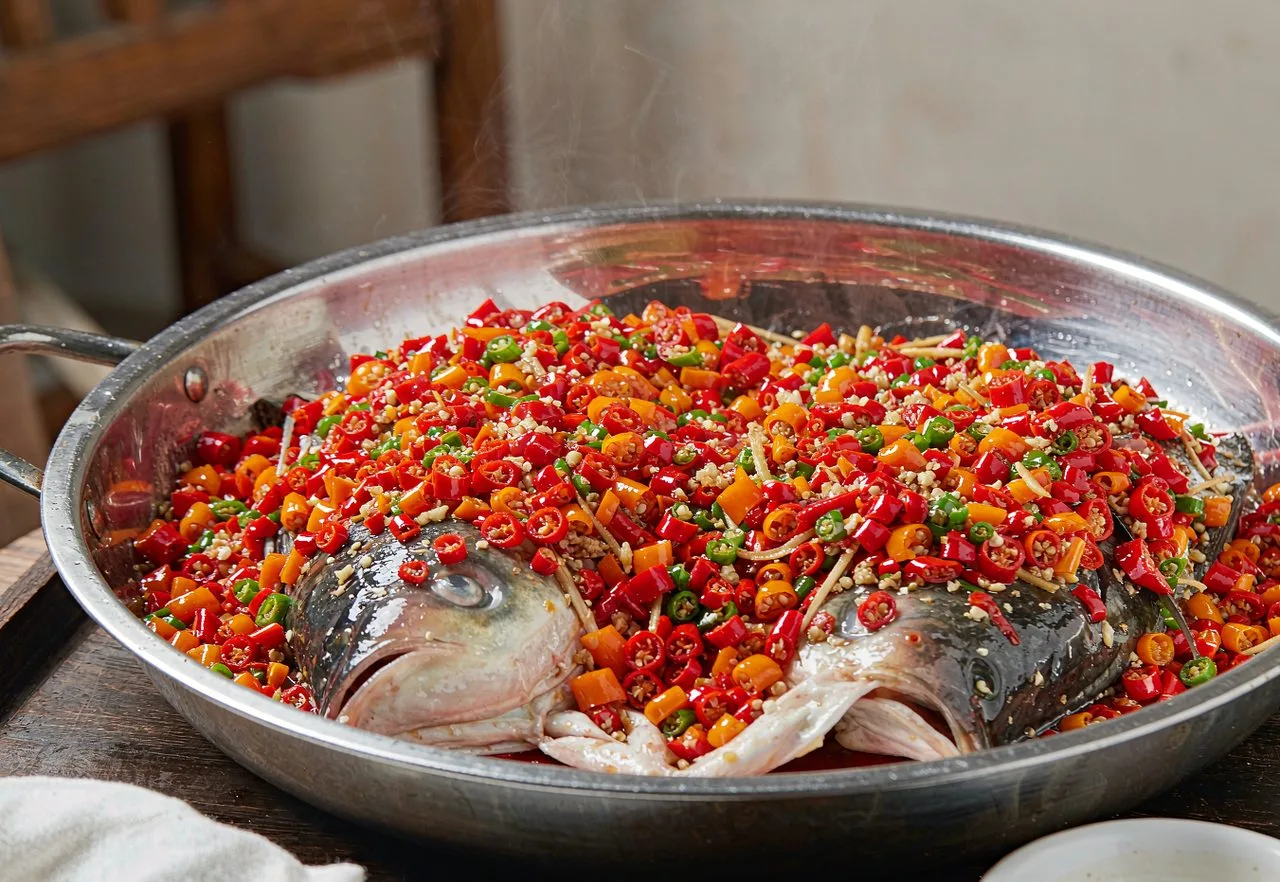 Hunan steamed fish head covered with chopped chillies