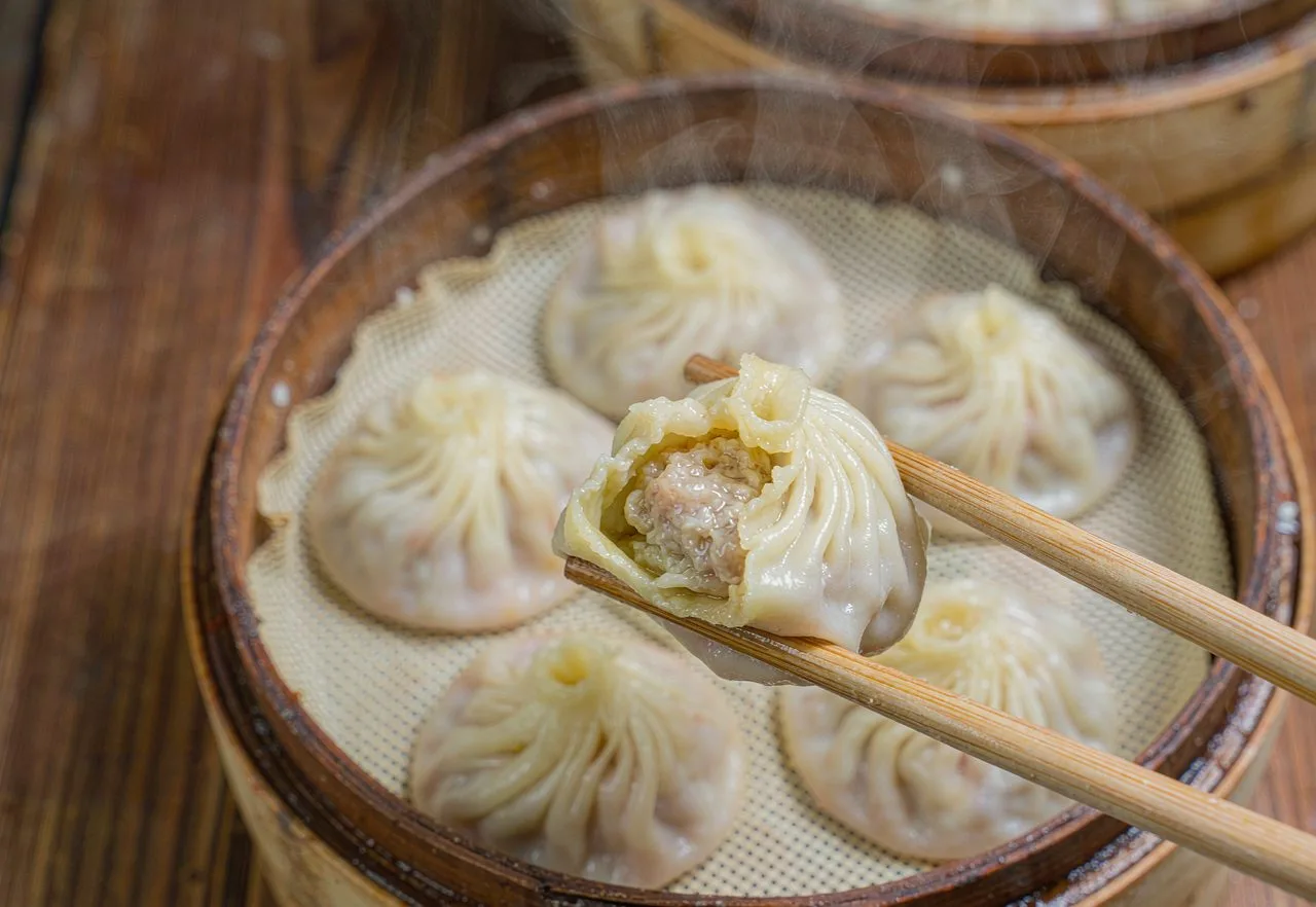Shanghai xiaolongbao soup dumplings in a bamboo steamer