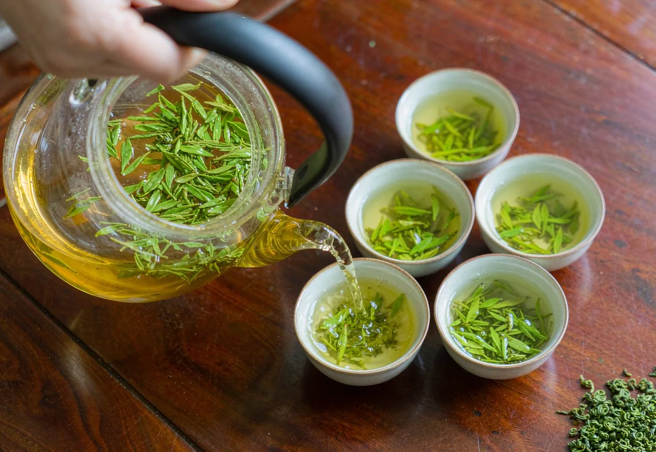 A Chinese green tea set with teapot and small cups