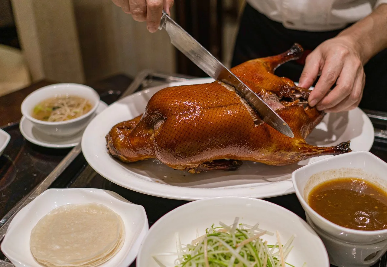 A whole Peking duck carved at the table in a Beijing restaurant