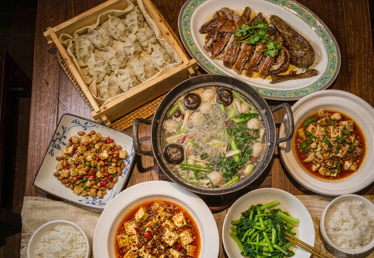 A spread of classic Chinese dishes on a restaurant table