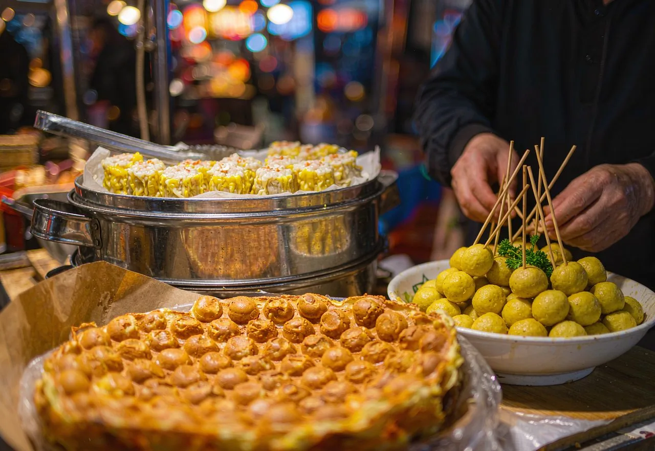 Hong Kong street snacks: egg waffle, curry fish balls and siu mai at a night stall