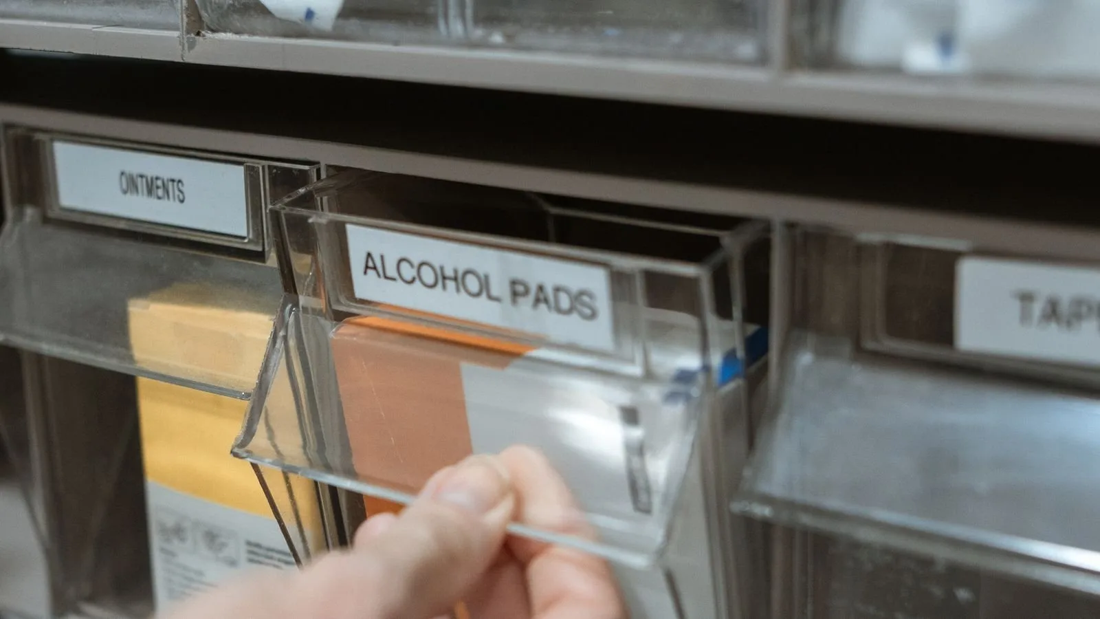 Close-up of organised medicine shelves in a pharmacy