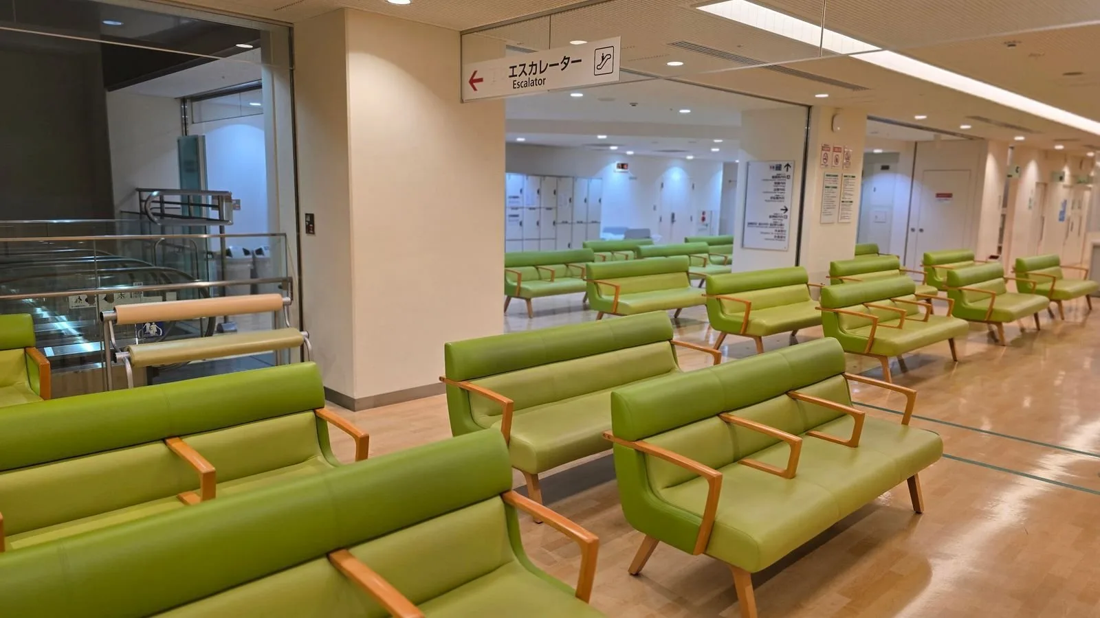 Quiet hospital waiting area with rows of seating