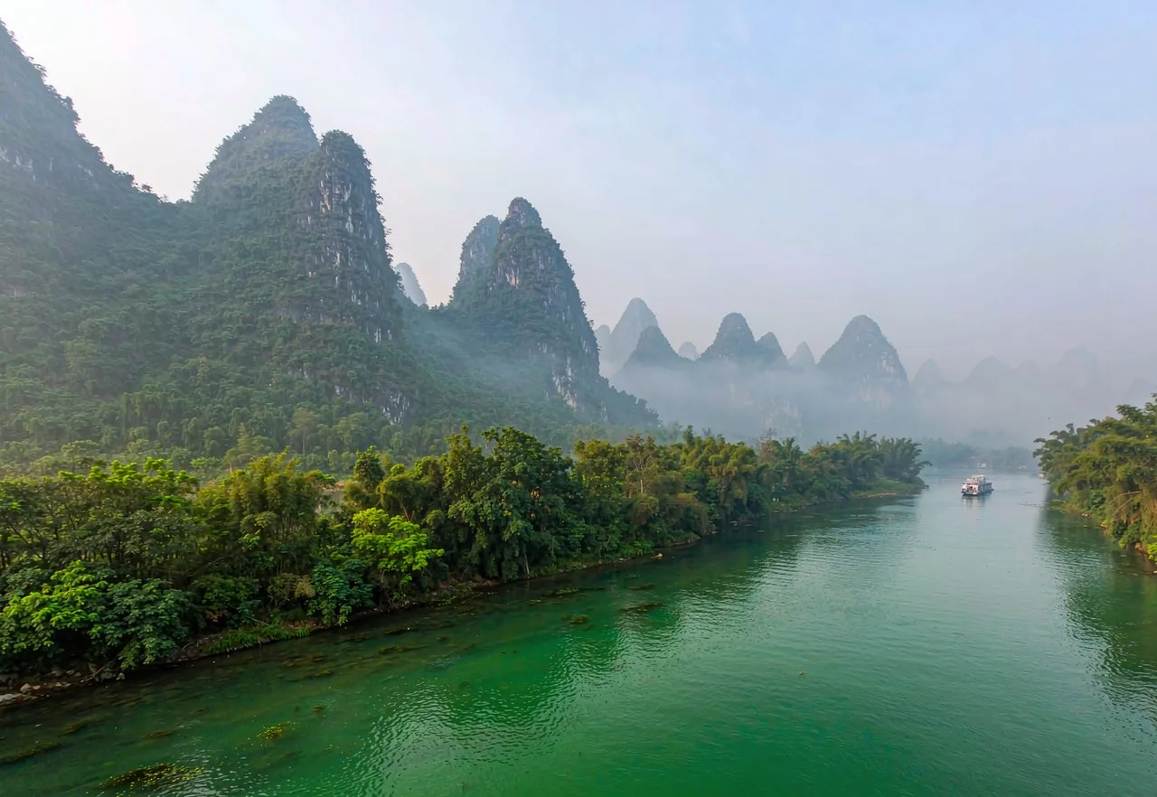 Li River cruise winding through karst peaks near Guilin