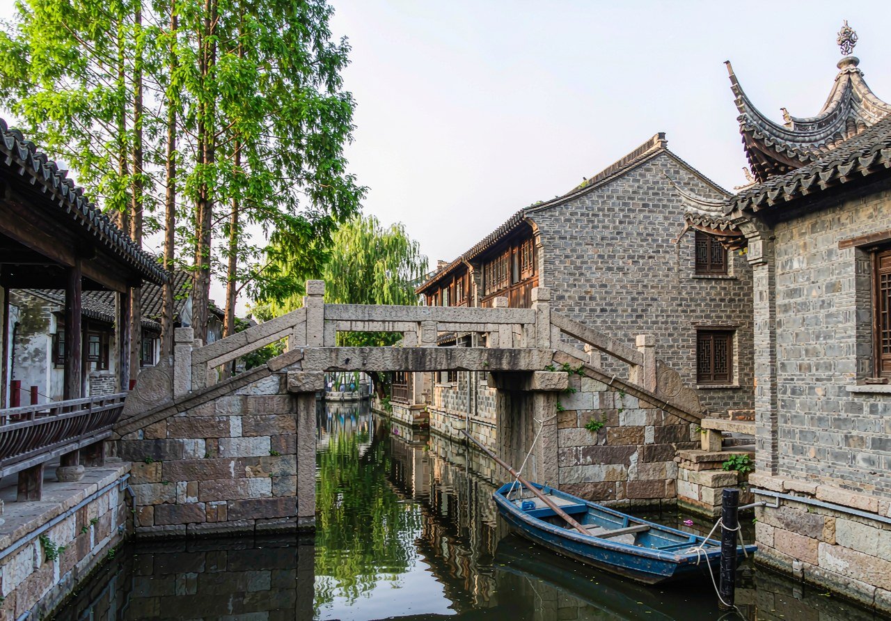 A stone bridge and canal boat in Zhujiajiao water town near Shanghai