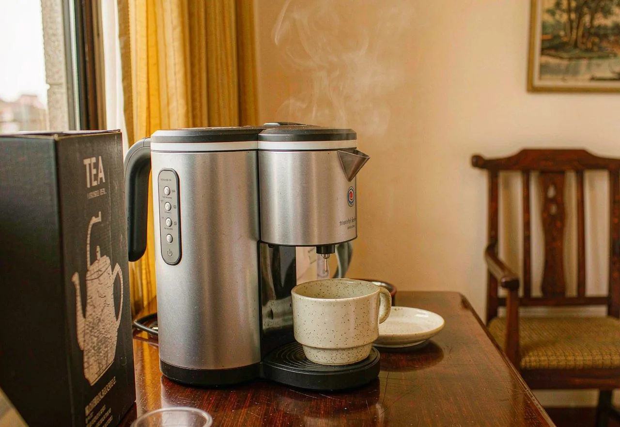 An electric kettle boiling water in a Chinese hotel room - boil your own drinking water cheaply