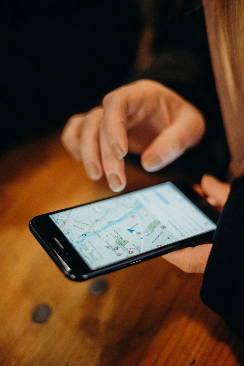 A phone showing a map navigation app for finding an address
